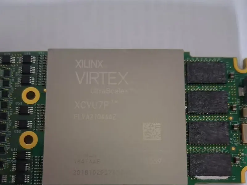 A Xilinx Virtex UltraScale+ FPGA chip on a circuit board