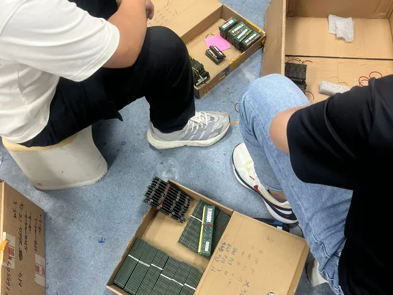 DRAM modules being sorted and graded from open boxes