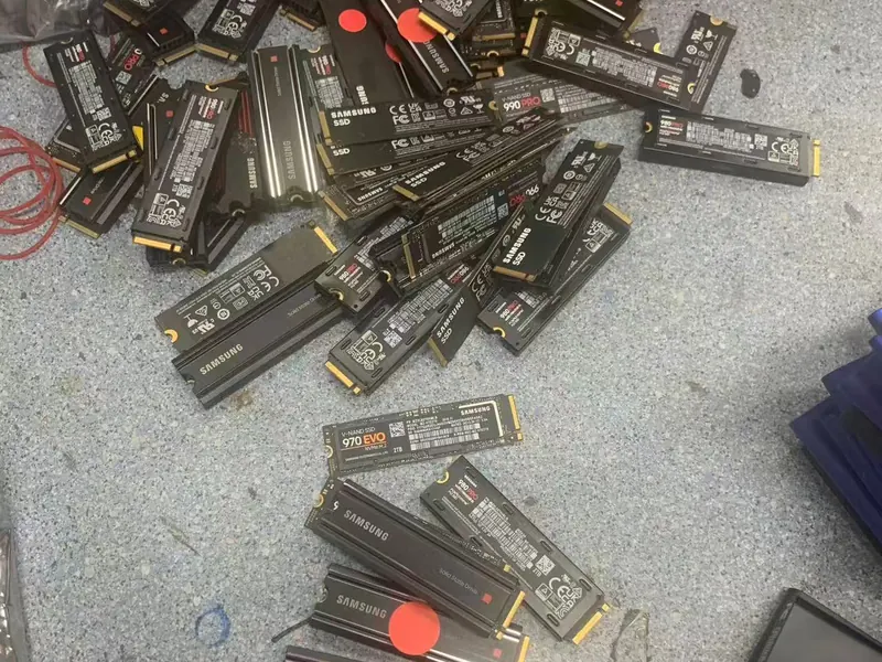 A large purchased lot of Samsung NVMe SSDs laid out after intake