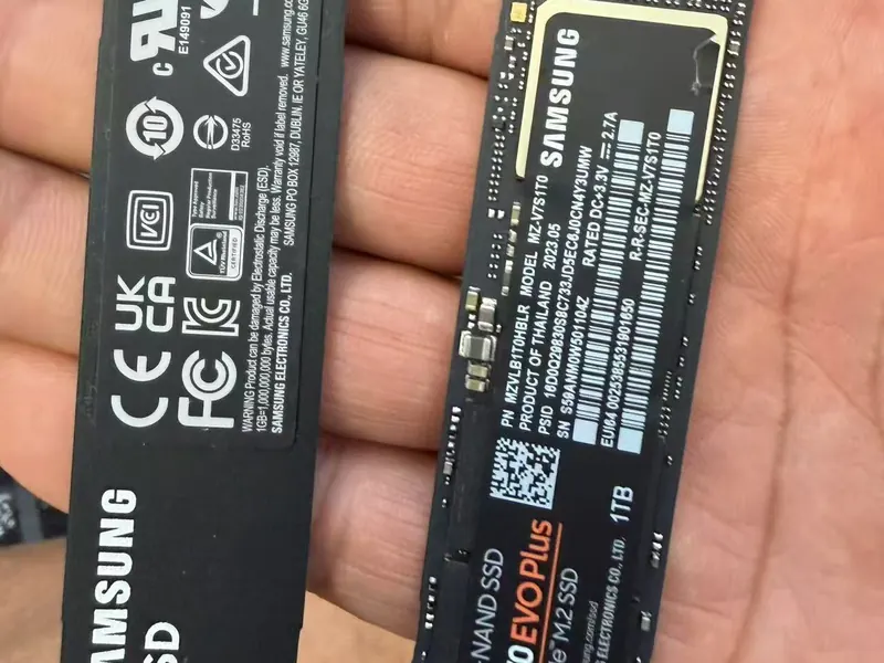 Two Samsung NVMe M.2 SSDs held in a hand